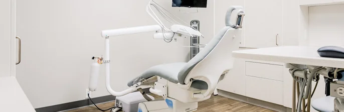 Modern dental chair in a clean clinic, illustrating advanced care solutions in dental risk management.