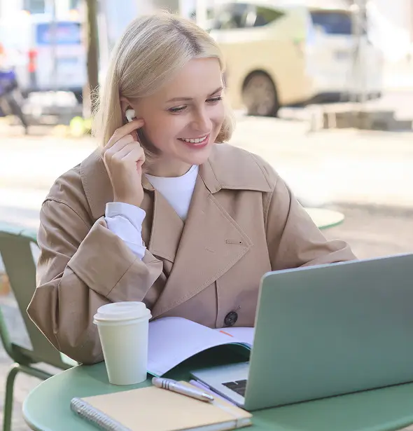 Professional woman engaging in remote work, illustrating effective employee benefits communication and guidance.