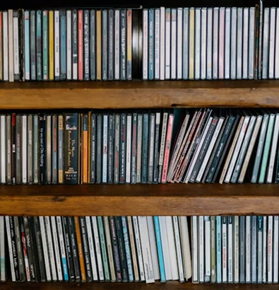 Shelves filled with well-organized CDs, highlighting collection protection and insurance insights.